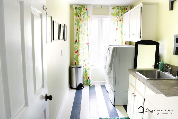 You don't have to live with old, outdated and ugly vinyl floors! You can paint them! Learn how to paint vinyl floors with this detailed tutorial. Mine are holding up perfectly even after 4 years of daily use!