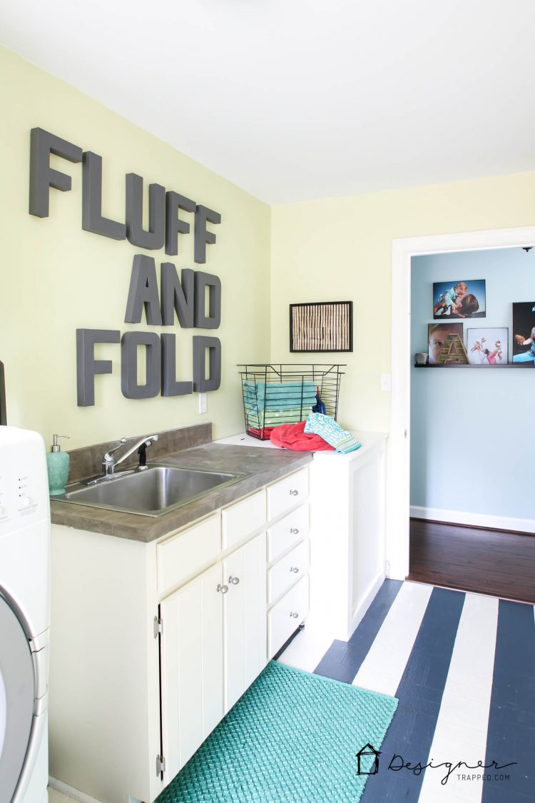 You don't have to live with old, outdated and ugly vinyl floors! You can paint them! Learn how to paint vinyl floors with this detailed tutorial. Mine are holding up perfectly even after 4 years of daily use!