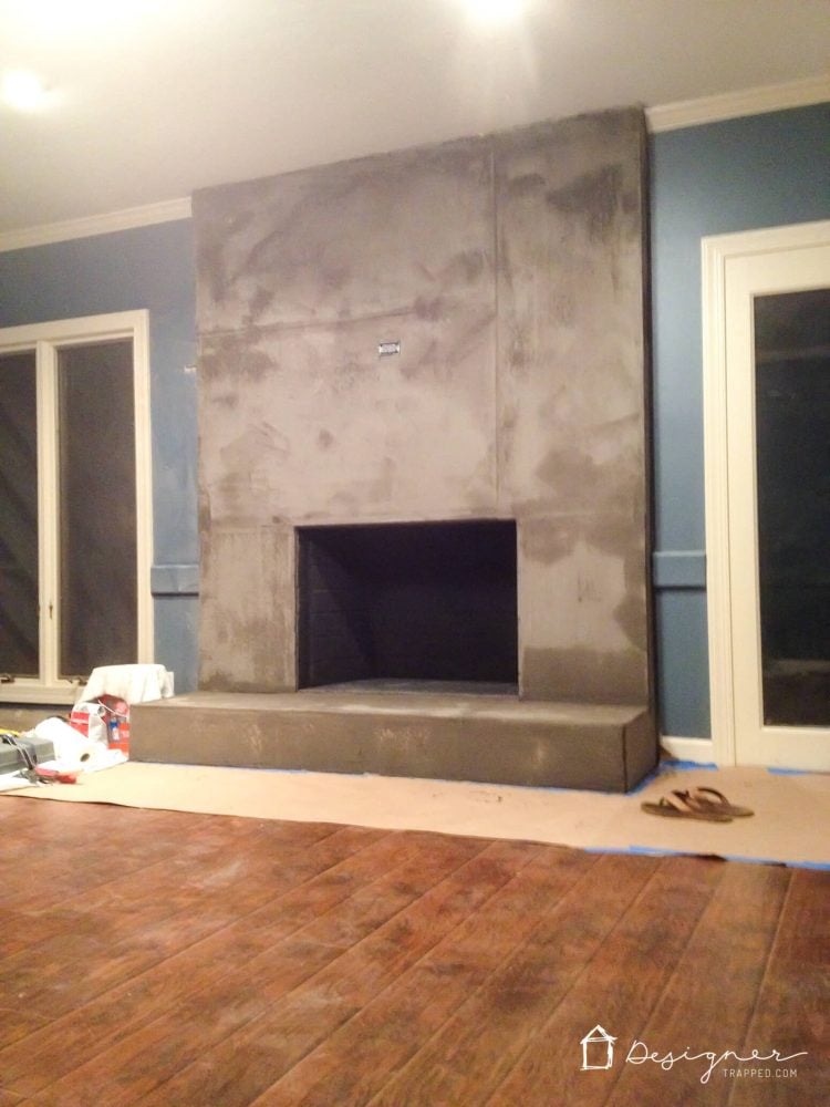 DIY Concrete Fireplace For Less than $100! | Designertrapped.com You can create a contemporary DIY concrete fireplace! We did it with some elbow grease and less than $100. Come learn how with this detailed tutorial.