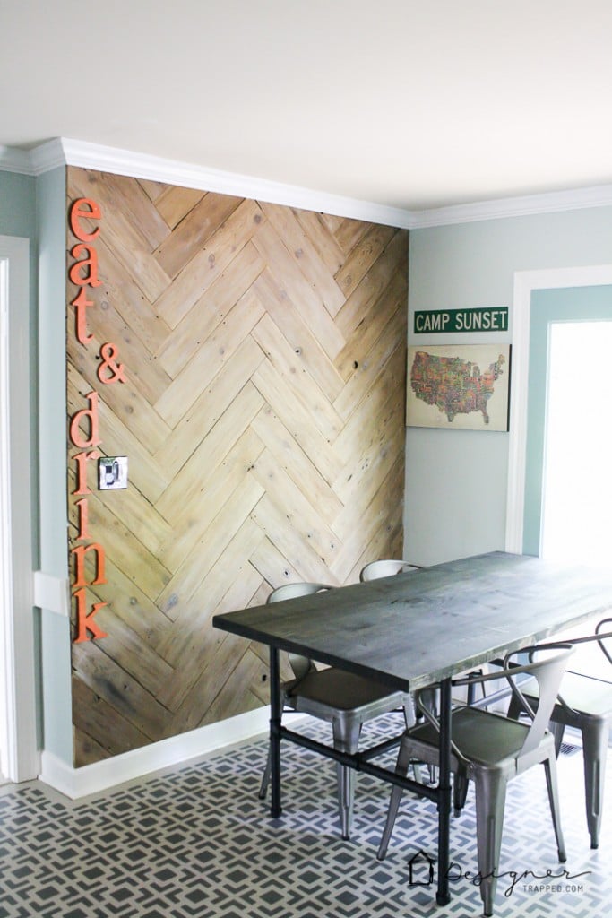 OMG! This DIY plank wall in a herringbone plank wall is AWESOME. Love that the blogger upcycled it from an old, ugly fence that she tore down!