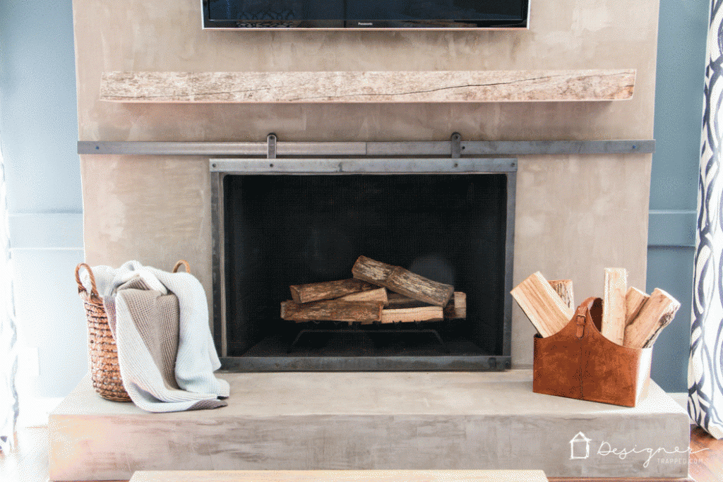DIY Concrete Fireplace For Less than $100! | Designertrapped.com You can create a contemporary DIY concrete fireplace! We did it with some elbow grease and less than $100. Come learn how with this detailed tutorial.