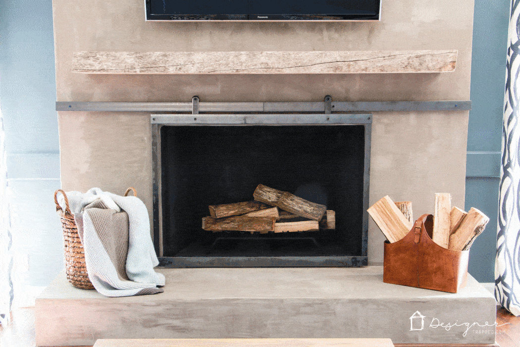 Learn how to make a barn door style fireplace screen without welding! This DIY sliding fireplace screen is easier than it looks to make!